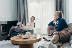 Two people working through a support plan together in a living room